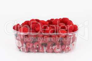 Fresh raspberries in plastic container