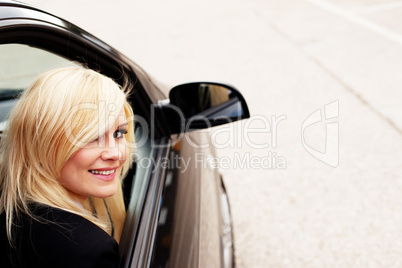 Pretty blonde automobile passenger