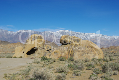 Rock formation and snowy mountains,Alabama Hills, California