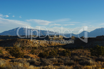 Sandstone and sand formations with Henry Mountains, Utah