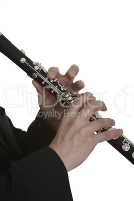 Clarinet player in front of white background