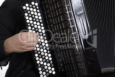 Accordion Player in front of white background