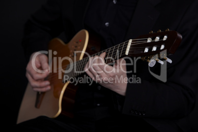 Guitarplayer on black