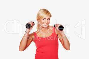 Fit woman lifting dumbbells