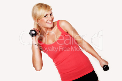 Fit woman lifting dumbbells