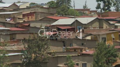 Pan across houses in a poor suburb in Kigali