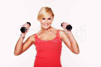 Fit woman lifting dumbbells