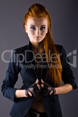 Beautiful redhead girl posing in studio