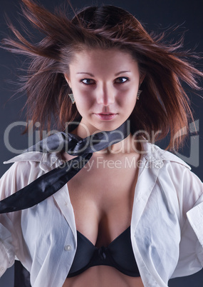 Beautiful girl in bra and men's shirt