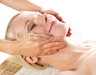 Gorgeous young woman relaxing in a spa salon