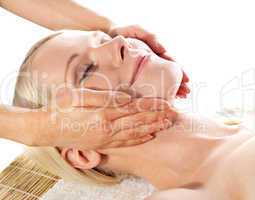 Gorgeous young woman relaxing in a spa salon