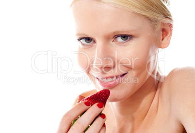 Closeup of young gorgeous girl holding strawberry