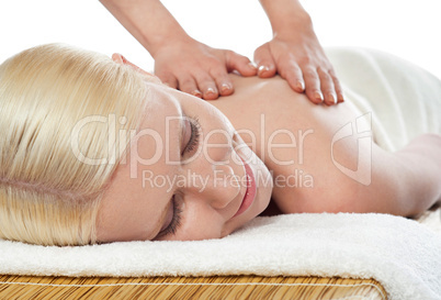 Attractive young spa lady getting a massage