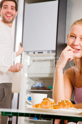 couple in kitchen having breakfast