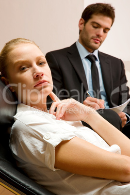 psychiatrist examining a female patient