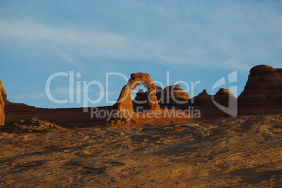 Delicate Arch in first morning light from a distance, Arches National Park, Utah
