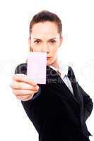 Young businesswoman holding sheets of paper on white background