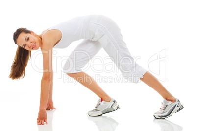 Young woman doing gymnastics on white background studio