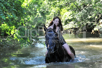 woman and  horse in the river