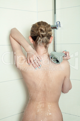 woman is taking a shower and relaxing