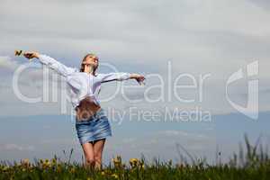 young woman is happy outdoor in summer