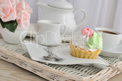 Cake with a cup of coffee on a tray