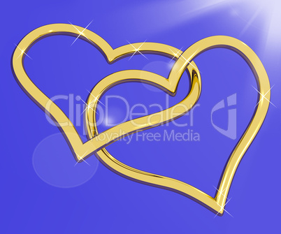 Gold Heart Shaped Rings On Blue Representing Love And Romance