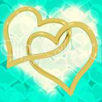 Gold Heart Shaped Rings On Turquoise Bokeh Representing Love And