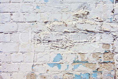 white textured brick wall painted