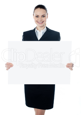 Businesswoman holding a blank white poster