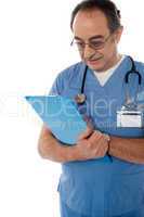 Medical specialist studying report