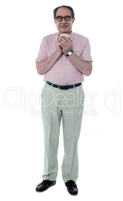 Senior male enjoying hot coffee