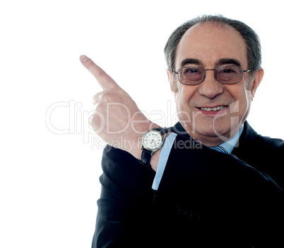 Caucasian old businessman pointing upwards