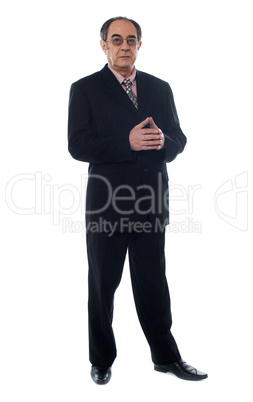Full length view of elder businessman posing