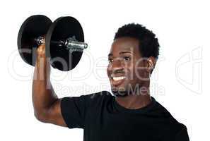 Powerful muscular young man lifting weights