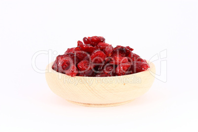 Dried cranberries in wooden bowl
