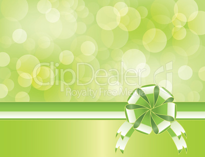 Green background with bow   and blurry light