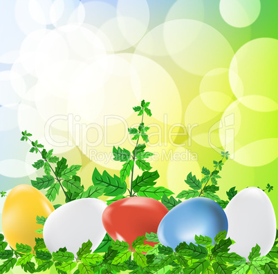 Colored easter eggs on green background with grass