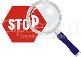 stop sign under magnifying glass