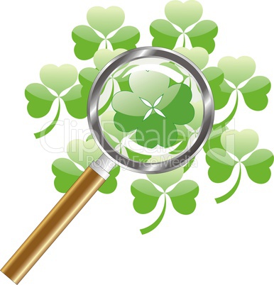luck search -  four leaf of clover or shamrock under  magnifying glass