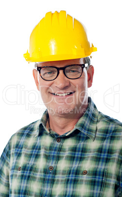 Closeup of senior architect in hardhat, smiling