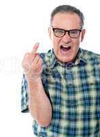 Image of a displeased man showing middle finger