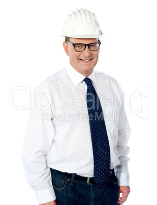 Handsome smiling aged engineer with hard hat