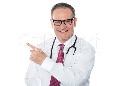 Medical professional pointing away