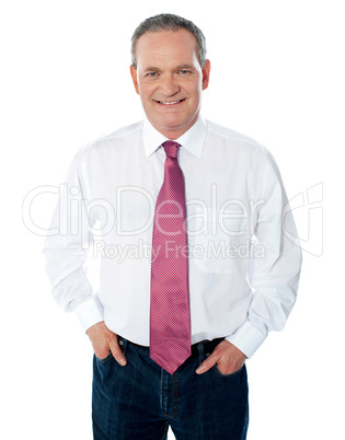 Casual senior businessman posing