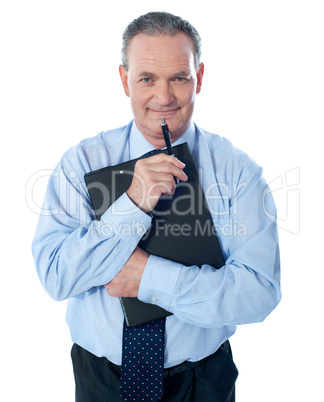 Businessman holding clipboard