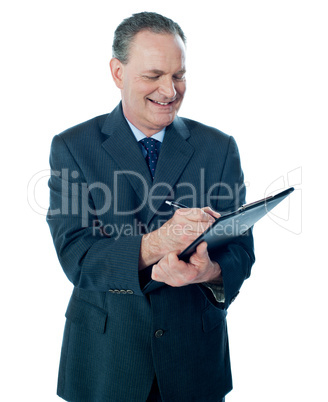Elder confident man making business notes