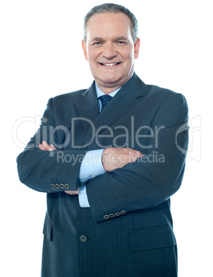 Matured businessperson posing with crossed arms