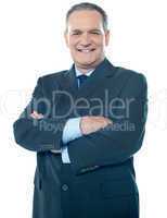 Matured businessperson posing with crossed arms