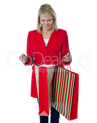 Shppoing woman looking inside empty bag